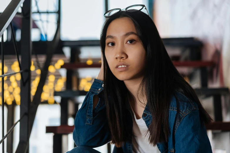 a woman sitting on top of a wooden bench, pexels contest winner, hyperrealism, young cute wan asian face, sitting in a cafe, avatar image, aged 13