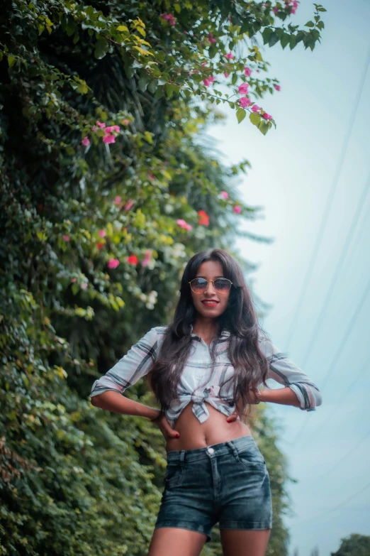 a woman standing in the middle of a road, by Max Dauthendey, wearing crop top, vine covered, full frame image, long hair girl