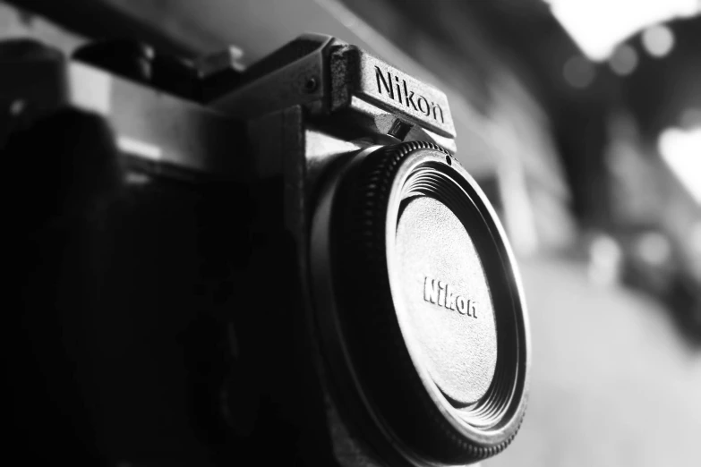 a black and white photo of a camera, by Niko Henrichon, nikon camera, close-up!!!!!, nikkon, fotografia blanco y negro