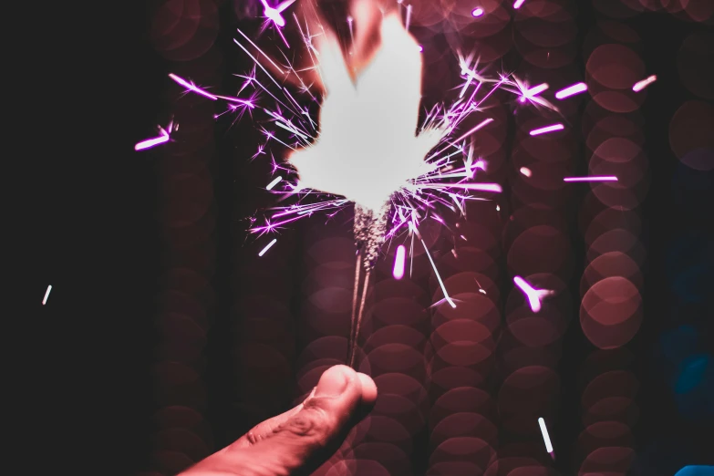 a person holding a sparkler in their hand, visual art, second colours - purple, teaser, spangle, 4th of july