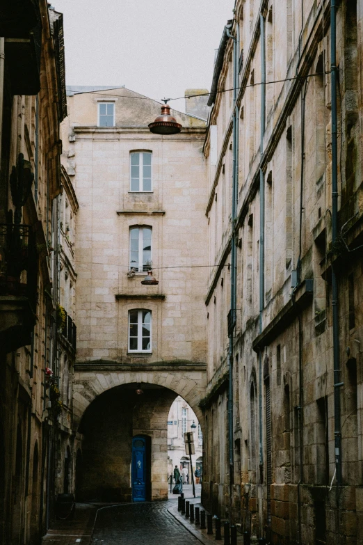 a narrow street in an old european city, an album cover, by Kristin Nelson, pexels contest winner, romanesque, archs, port, prefecture streets, shot from a distance