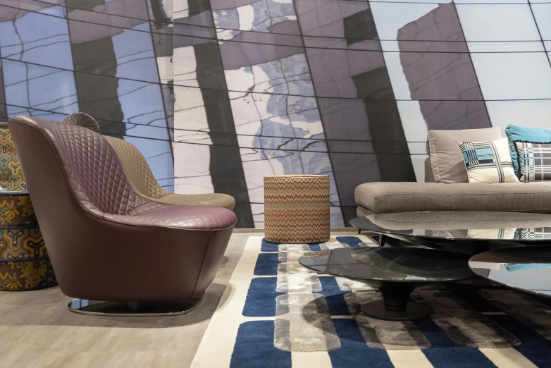 a living room filled with furniture and a large mural, inspired by William Berra, unsplash, pininfarina, maroon and blue accents, promo image, grey