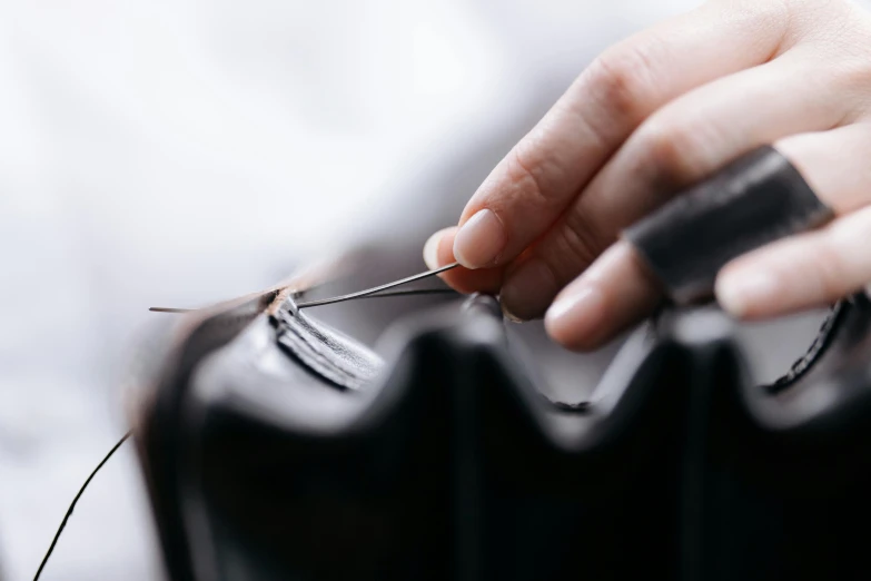 a close up of a person cutting a person's hair, trending on pexels, hurufiyya, thick wires looping, holding a leather purse, restoration, resin