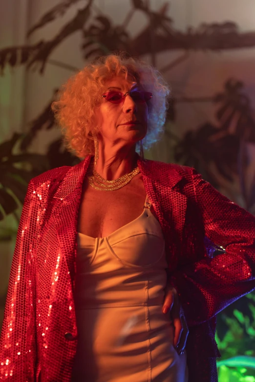 a woman in a white dress and a red jacket, inspired by Nan Goldin, pexels, wearing disco suit, older woman, neon jungle, scene from a movie