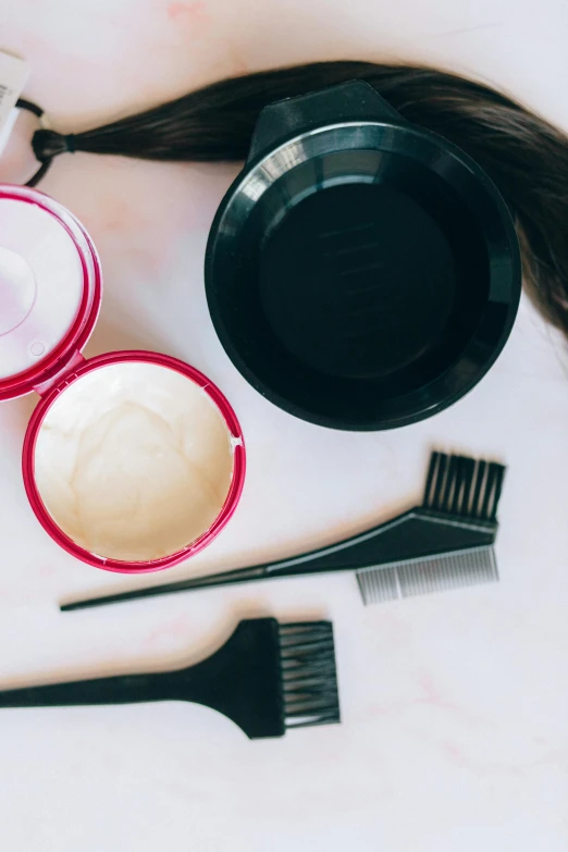 a pile of hair sitting on top of a table, a still life, by Julia Pishtar, trending on pexels, plasticien, paints mixing, product introduction photo, with black, combover