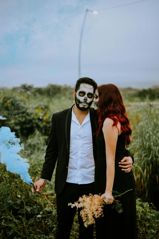 a man and a woman standing next to each other, a colorized photo, pexels contest winner, surrealism, skull face paint, romantic couple, background image, halloween scene