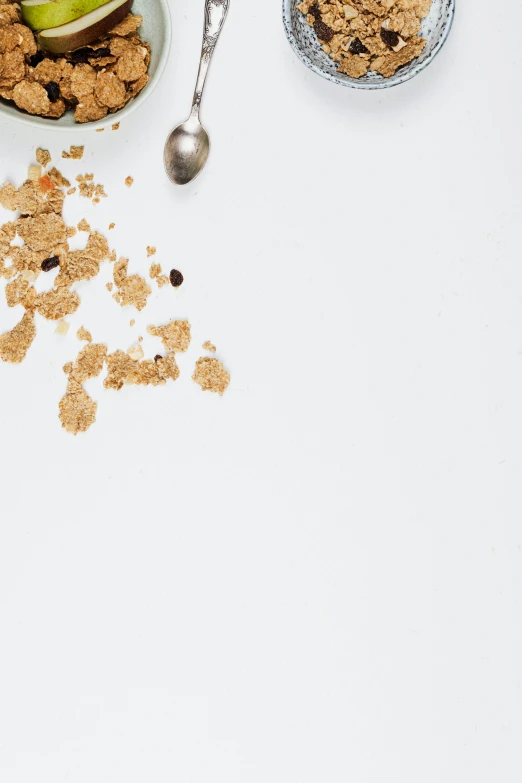 a white table topped with bowls of cereal and fruit, by Matthias Stom, trending on unsplash, minimalism, gold flakes, spores floating in the air, profile image, ignant