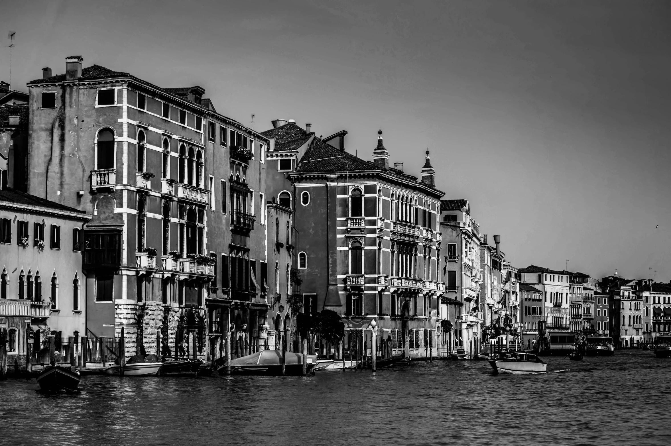 a black and white photo of a canal in venice, by Patrick Pietropoli, pexels contest winner, view from the sea, square, highly detailed!!, detailed buildings