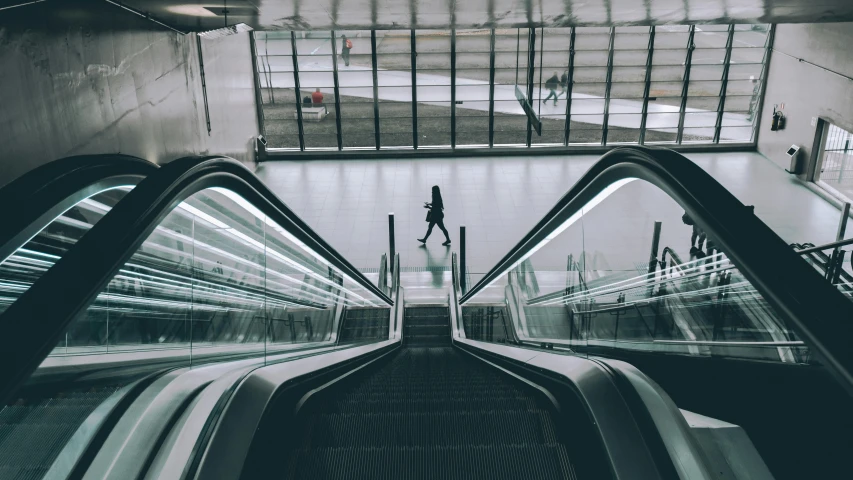 a black and white photo of an escalator, pexels contest winner, lone person in the distance, instagram post, bus station, technologies