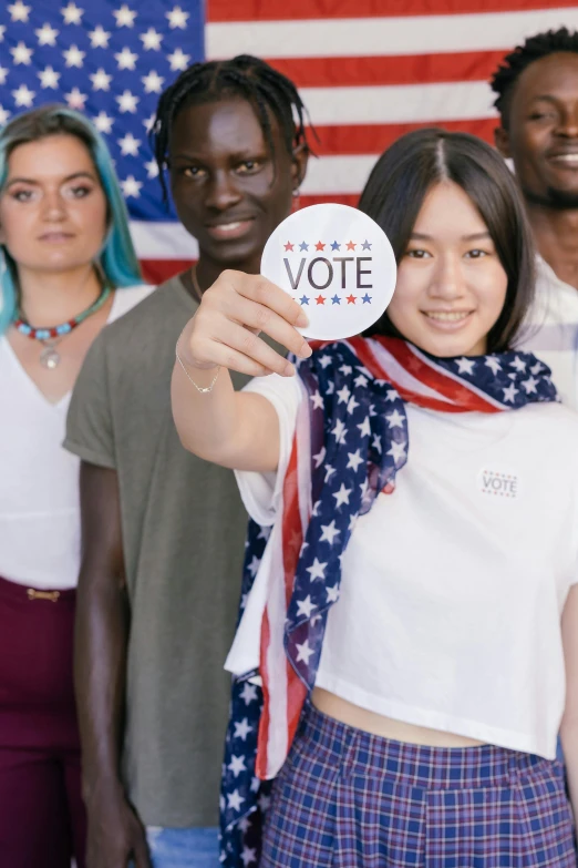 a group of people standing in front of an american flag, young asian woman, heavily upvoted, a person standing in front of a, pointing index finger