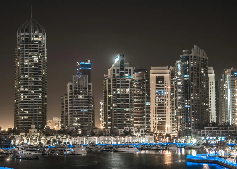 a large body of water surrounded by tall buildings, by Erik Pevernagie, pexels contest winner, hyperrealism, arabian night, group photo, fine art print, high quality picture