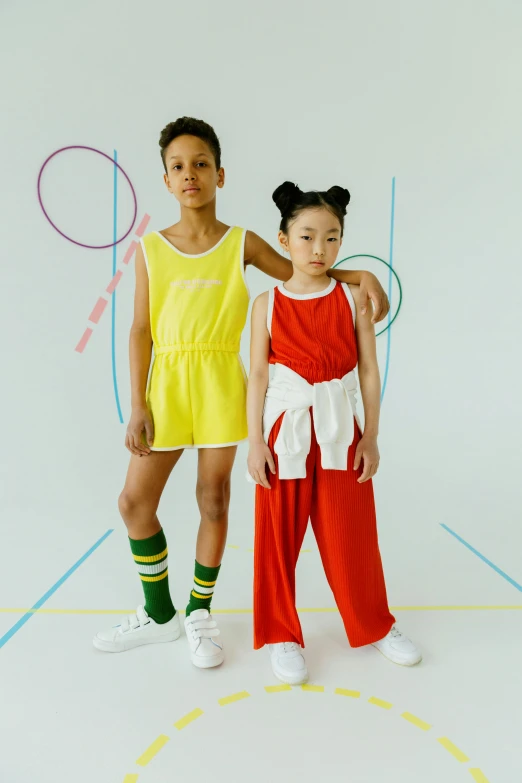 two young girls standing next to each other on a basketball court, by Ellen Gallagher, dribble, wearing red and yellow clothes, off - white collection, slide show, japanese collection product