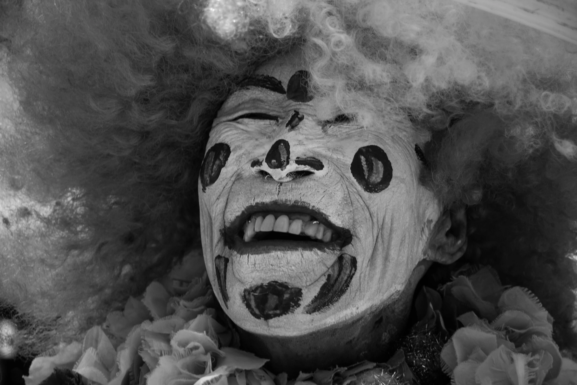 a black and white photo of a clown's face, by Jan Rustem, carnaval de barranquilla, mouth of hell, ronald mcdonald, from joker (2019)