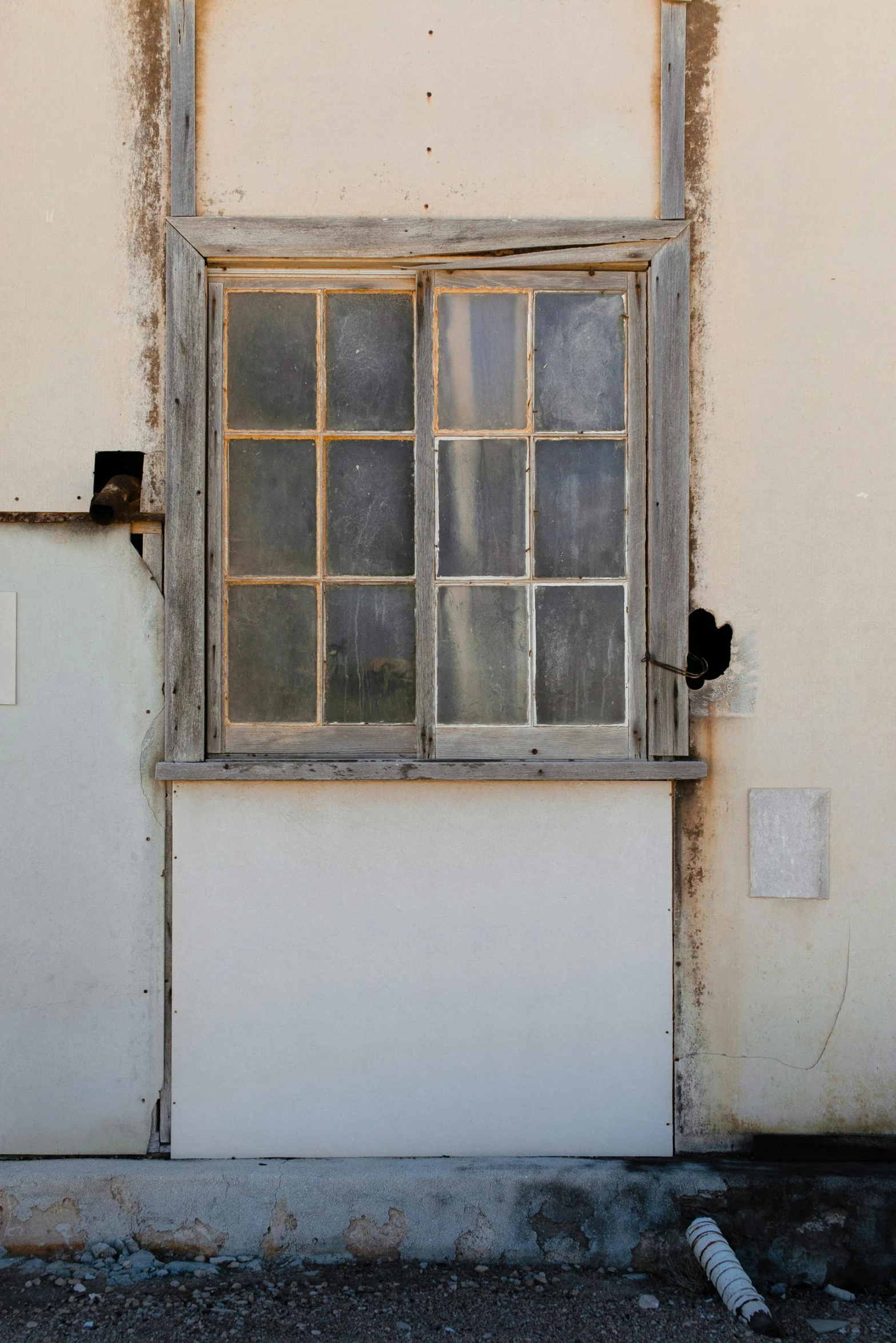 a fire hydrant sitting on the side of a building, an album cover, by Michael Sittow, renaissance, vintage frame window, ((rust)), crumbled wall in jerusalem, dressed in a worn