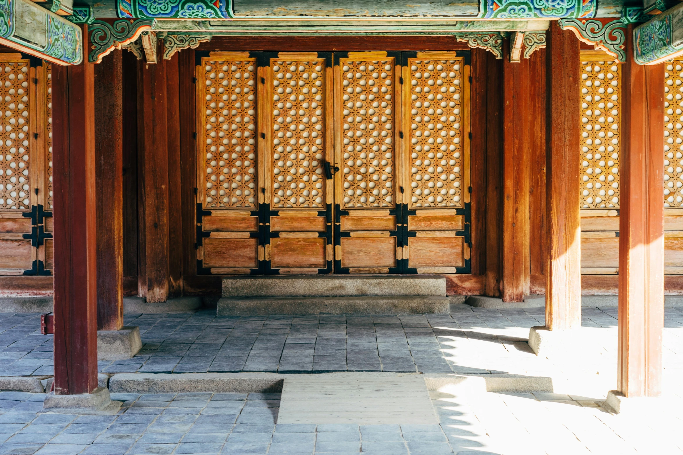 a building with a bench in the middle of it, inspired by Wang Yi, trending on unsplash, cloisonnism, wood door, korean traditional palace, brown, panels