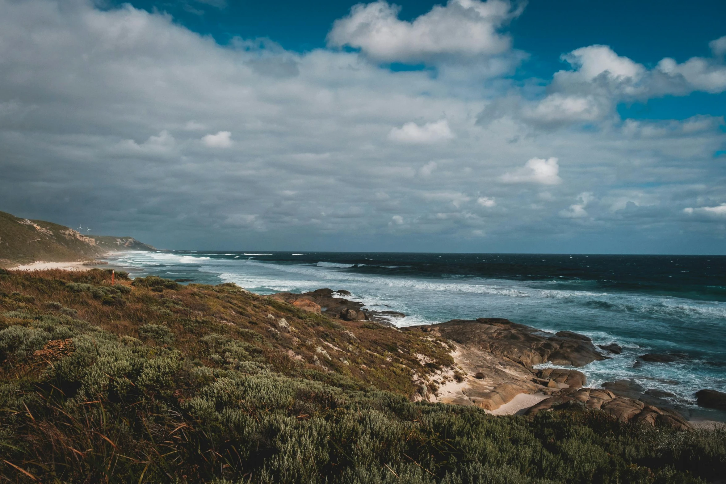 a view of the ocean from the top of a hill, pexels contest winner, australian beach, clouds and waves, thumbnail, rugged