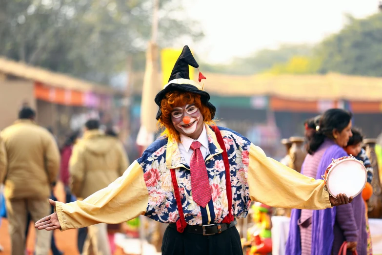 a clown standing in front of a crowd of people, pexels, guwahati, scarecrow, avatar image, posing for camera