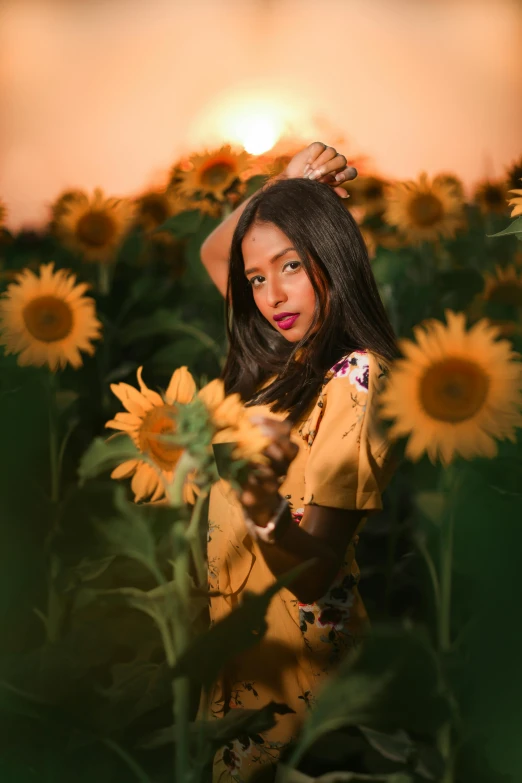 a woman standing in a field of sunflowers, an album cover, by Julia Pishtar, pexels contest winner, indian girl with brown skin, indoor picture, lights, sza