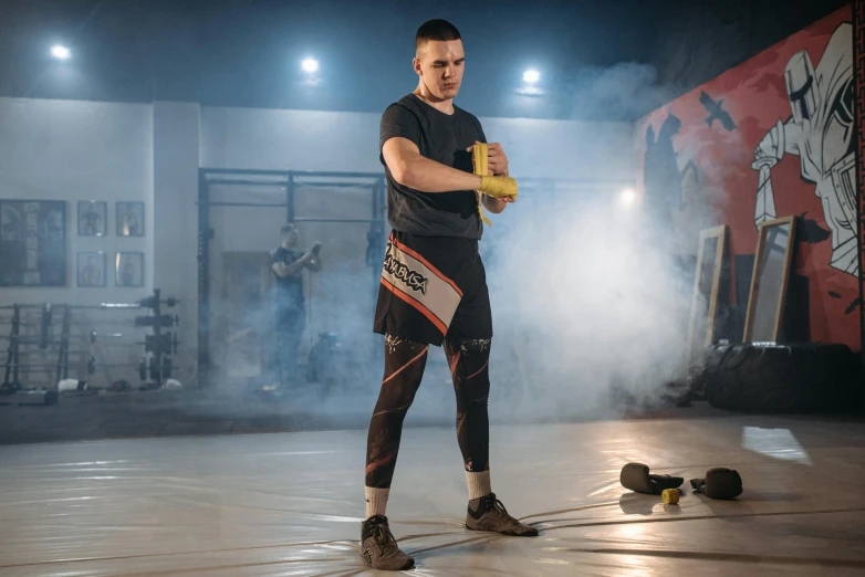 a man standing in the middle of a gym, by Alexander Fedosav, preparing to fight, avatar image, performance, conor walton