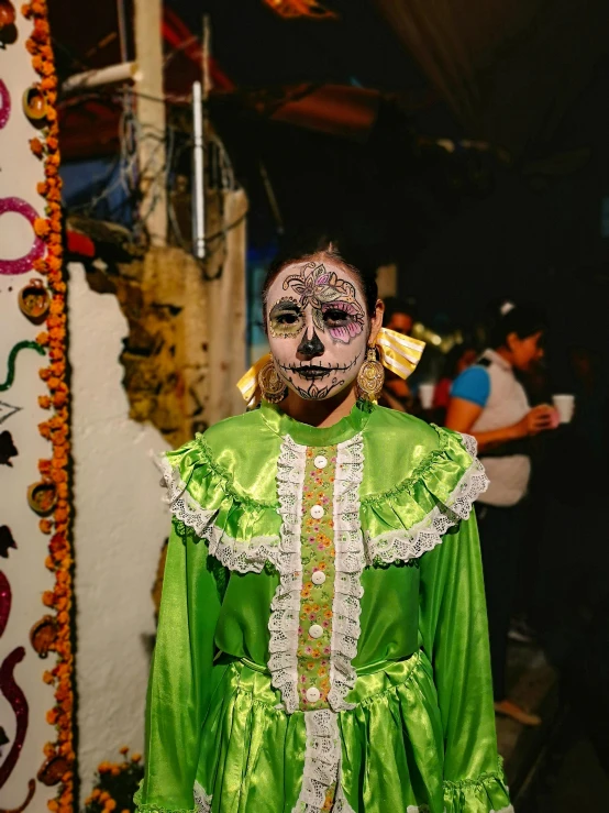 a man dressed up in a green costume, a photo, pexels contest winner, lowbrow, la catrina, a person standing in front of a, lgbtq, pixelated