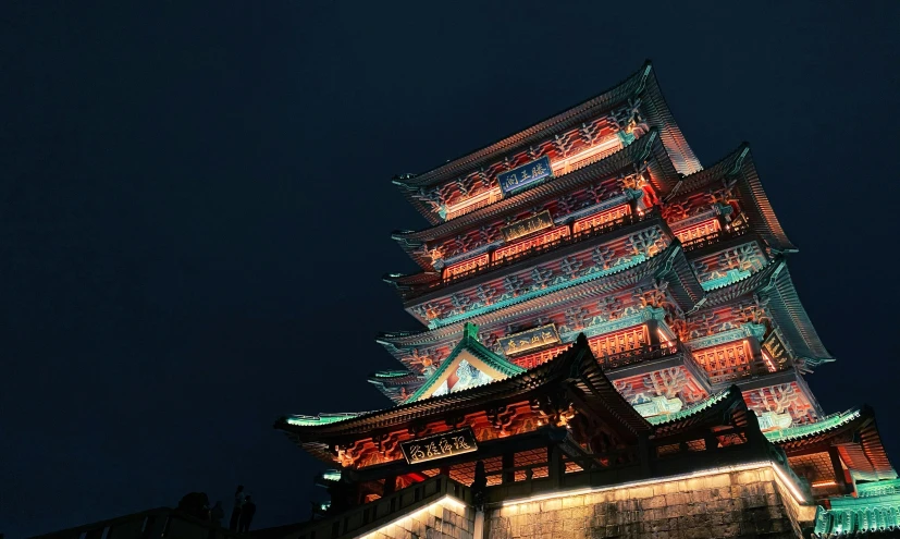 a tall building is lit up at night, by Sengai, pexels contest winner, shin hanga, ancient chinese architecture, red and cyan, 2 5 6 x 2 5 6 pixels, feudal era japan