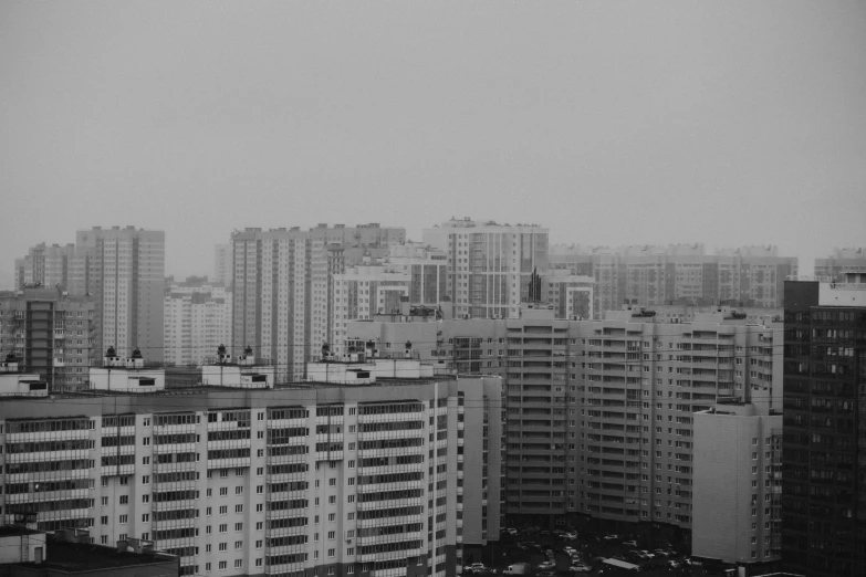 a black and white photo of a city, inspired by Thomas Struth, pexels contest winner, brutalism, in russia, gloomy weather. high quality, suburb, pyongyang city