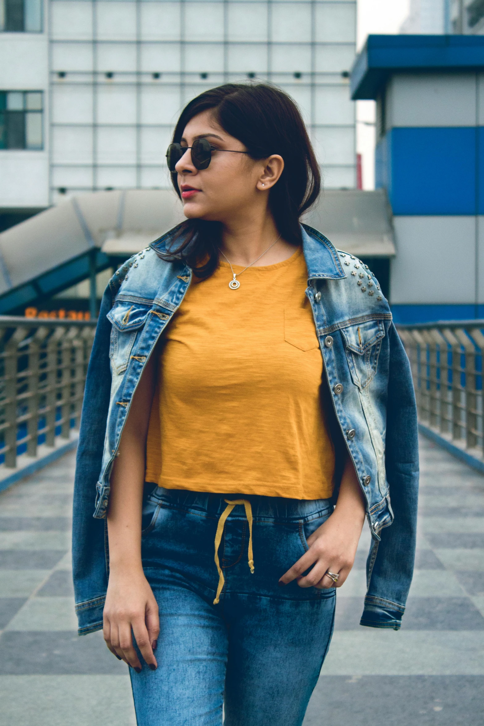 a woman in a yellow shirt and denim jacket, pexels contest winner, desi, wearing crop top, avatar image, fullbody photo