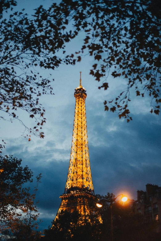 the eiffel tower is lit up at night, unsplash contest winner, art nouveau, 8k resolution”, square, late summer evening, tall thin