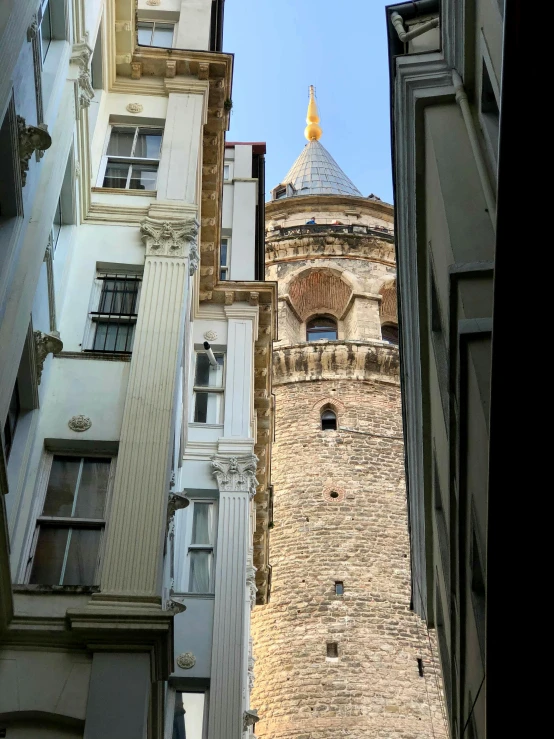 a tall clock tower towering over a city street, by Tom Wänerstrand, pexels contest winner, art nouveau, ottoman sultan, view from inside, photo on iphone, hyper - detailed color photo