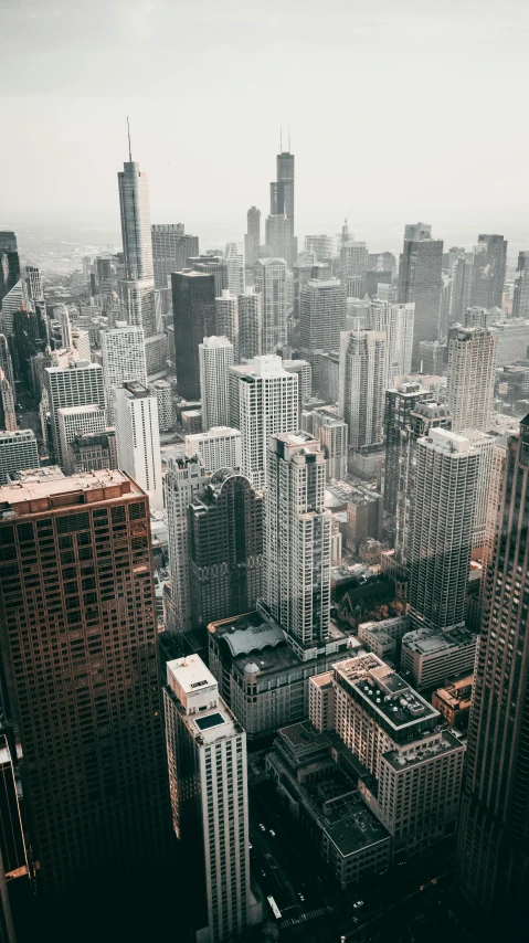 a view of a city from the top of a building, by Robbie Trevino, pexels contest winner, chicago, 15081959 21121991 01012000 4k, tall thin build, unsplash 4k