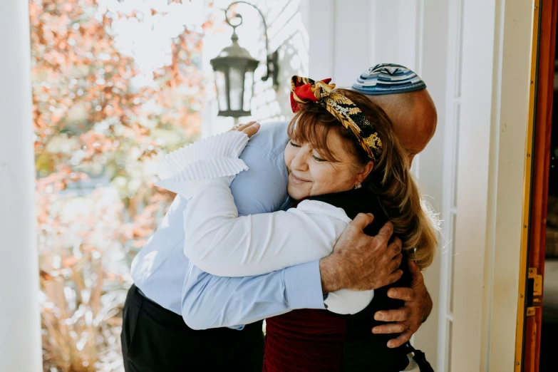 a couple of people that are hugging each other, annie leibowit, fully dressed, professionally done, bay area