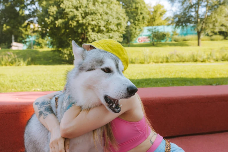 a woman sitting on a bench with a dog, an album cover, trending on pexels, holo is a wolf girl, maxim sukharev, hugging each other, mrbeast