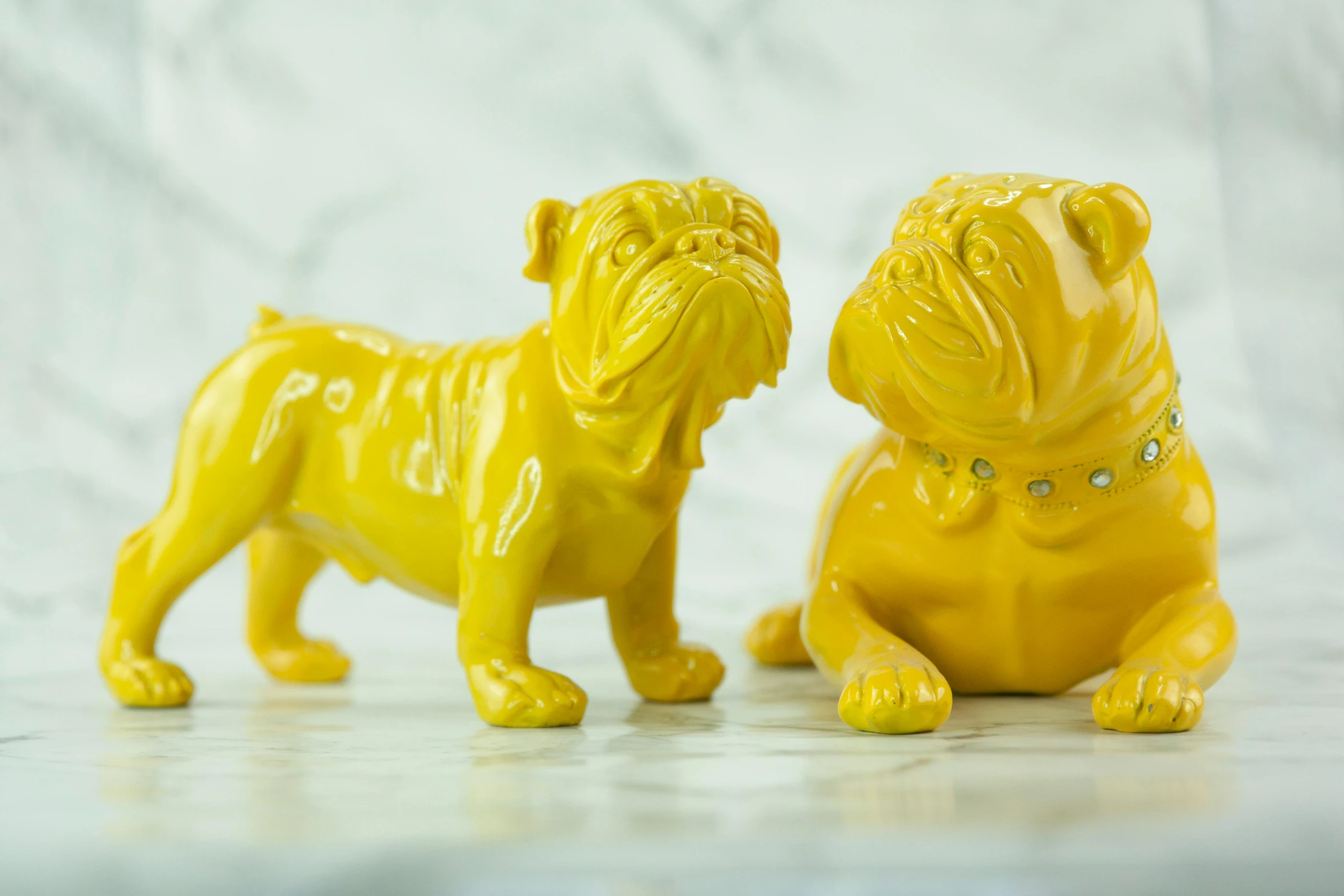 two yellow figurines of a dog and a cat, inspired by Fernando Botero, emma bridgewater and paperchase, bling, wrinkly, art set