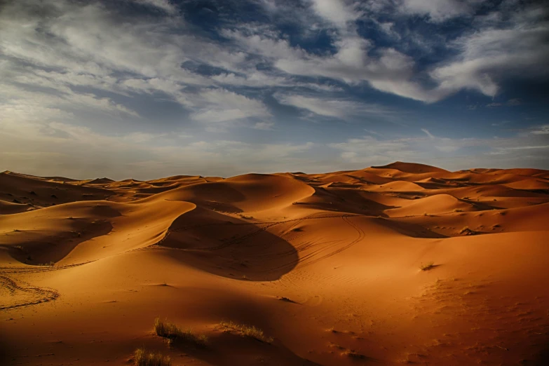 sand dunes in the desert under a cloudy sky, pexels contest winner, hurufiyya, red ocher, youtube thumbnail, dessert, orientalism