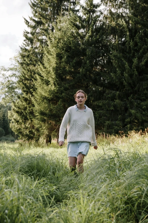 a little girl running through a field of tall grass, inspired by Jakob Häne, happening, stood in a forest, cinestill, adult, casually dressed