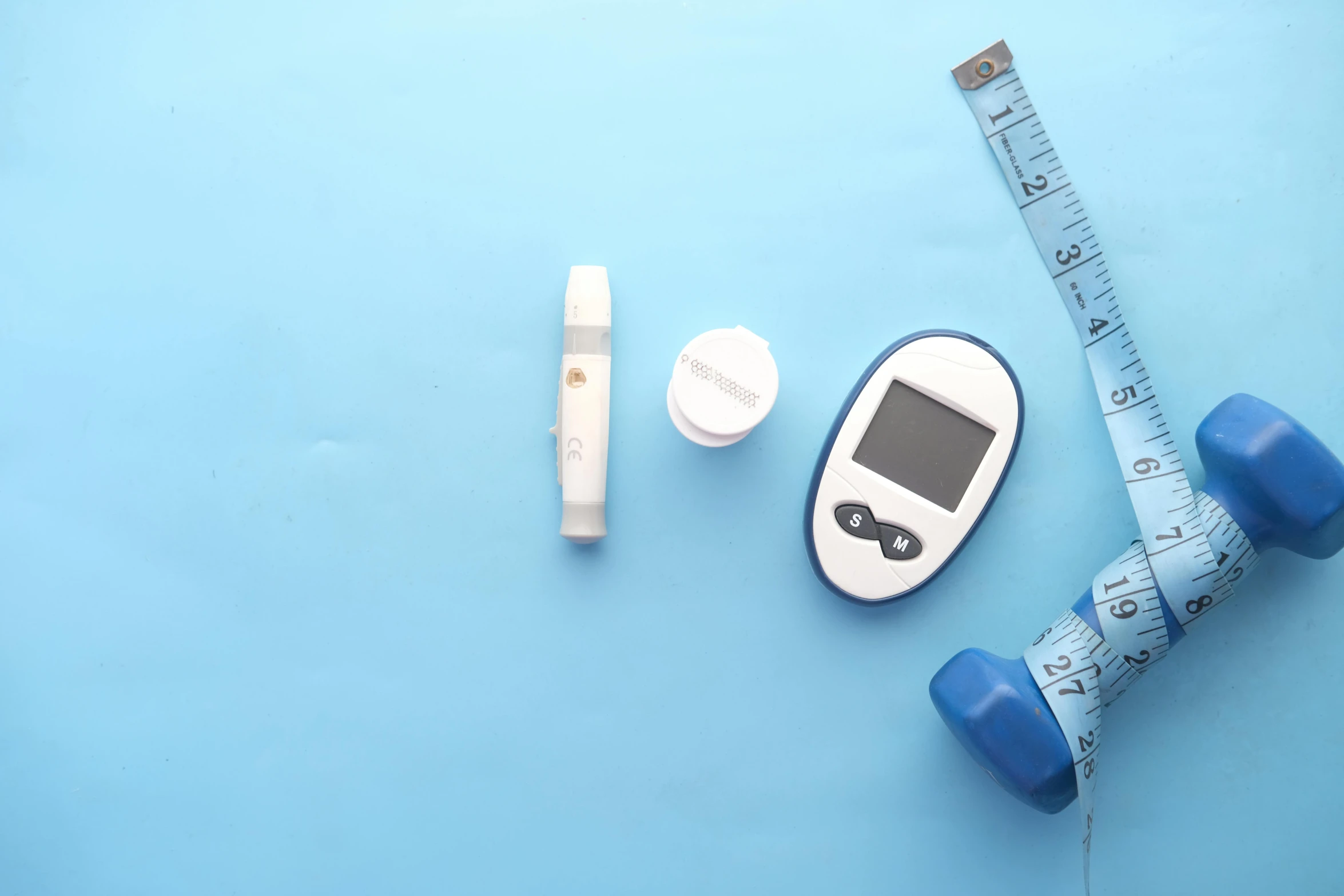 a measuring tape, a thermometer, and a measuring tape on a blue surface, a picture, by Daniel Lieske, pexels, small vials and pouches on belt, cane, medical machinery, background image