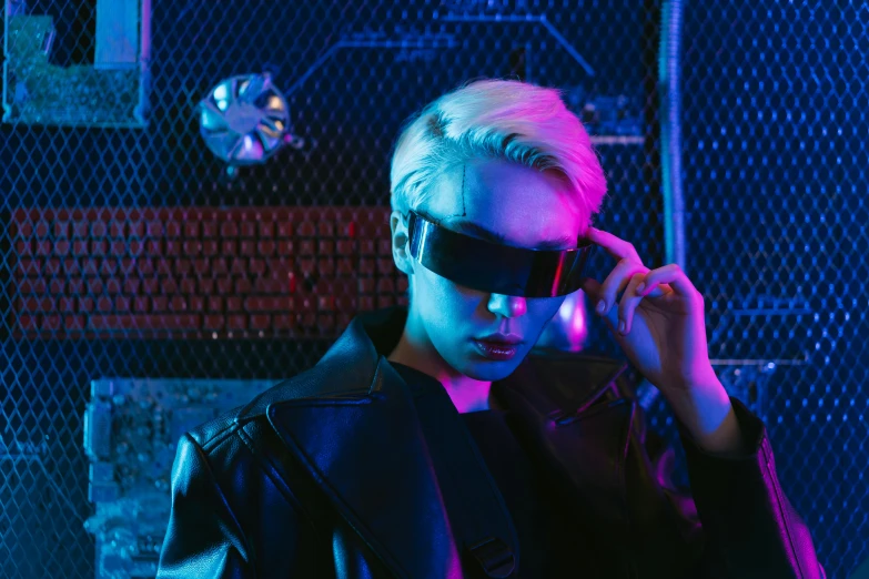 a man in a leather jacket holding a cell phone to his ear, cyberpunk art, inspired by Elsa Bleda, trending on pexels, neo-dada, short platinum hair tomboy, black blindfold, neon aesthetic, fashionable futuristic woman