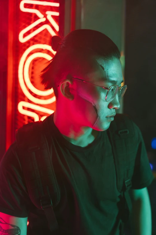 a man standing in front of a neon sign, inspired by Liam Wong, pexels contest winner, neo-dada, close-up portrait of cyborg, cai xukun, profile image, in a nightclub