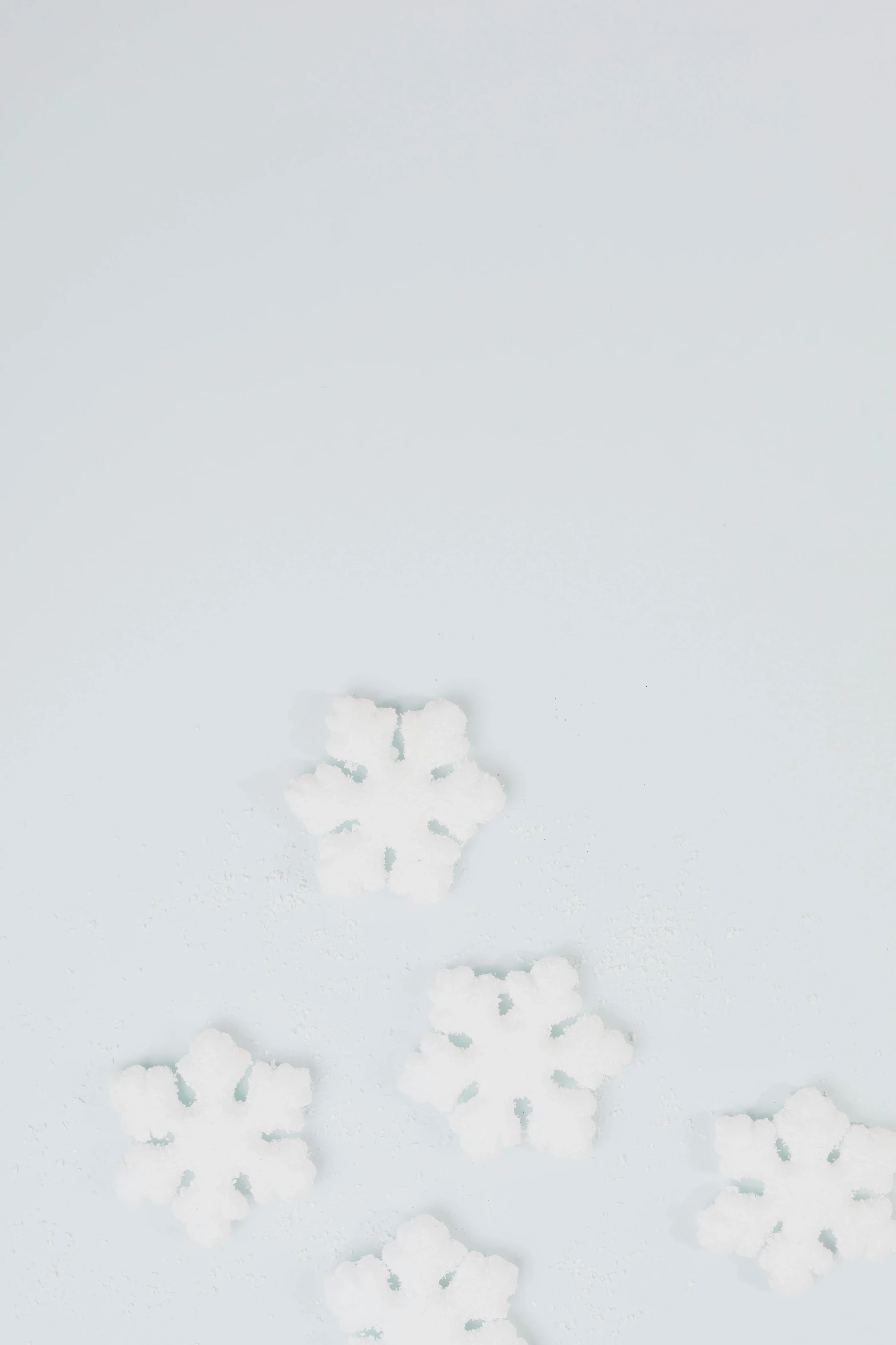 a bunch of snow flakes sitting on top of a table, a minimalist painting, trending on unsplash, white background : 3, promo image, candy decorations, background image