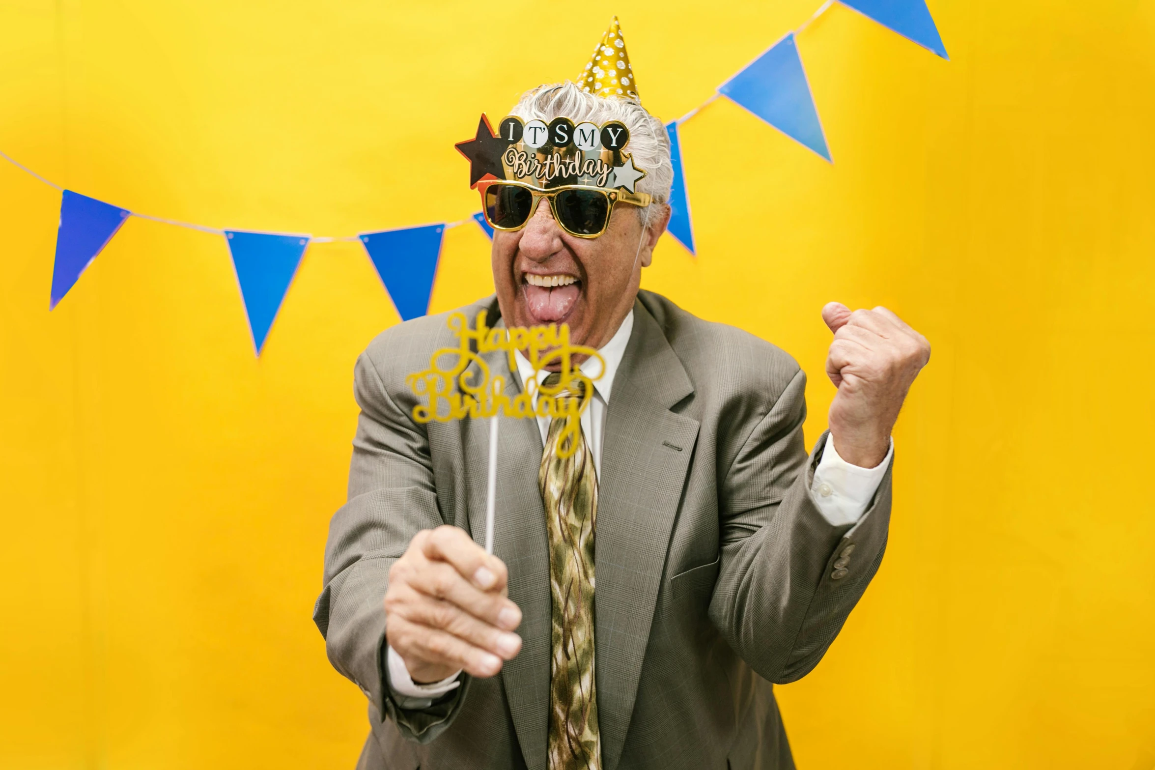 a man wearing a party hat and sunglasses, pexels, an elderly, yellow magic theme, happy birthday, thumbnail