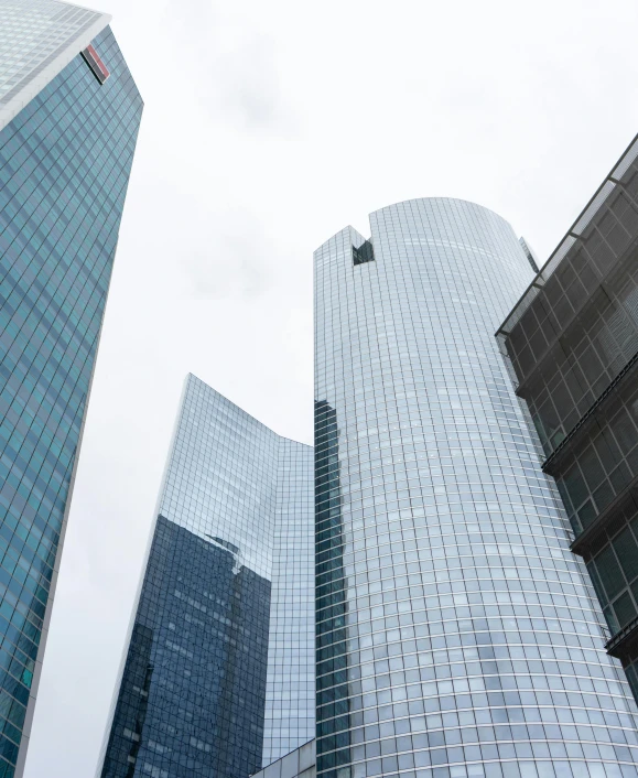 a couple of tall buildings sitting next to each other, pexels contest winner, modernism, futuristic france, low quality photo, fan favorite, high resolution photograph