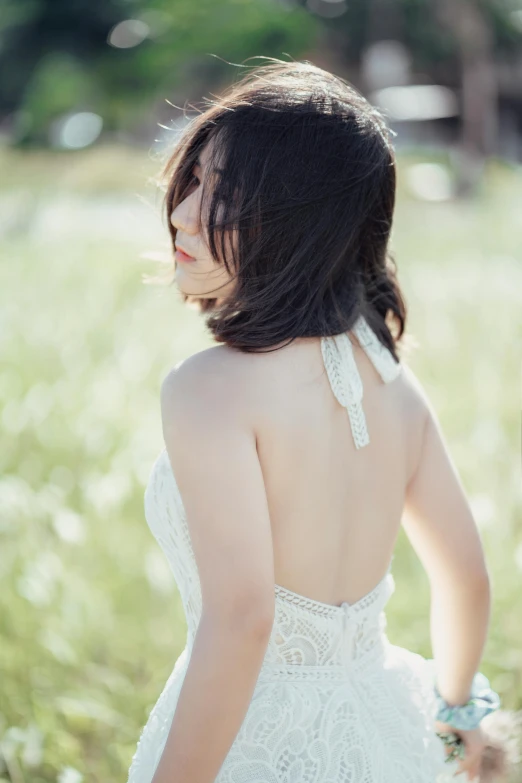 a woman in a white dress standing in a field, by Tan Ting-pho, unsplash, renaissance, halter neck, wedding photo, highly details, asian woman