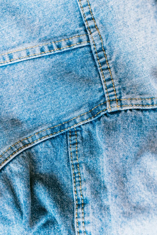 the back pocket of a pair of jeans, an album cover, trending on pexels, light-blue, dynamic closeup, made of lab tissue, half image