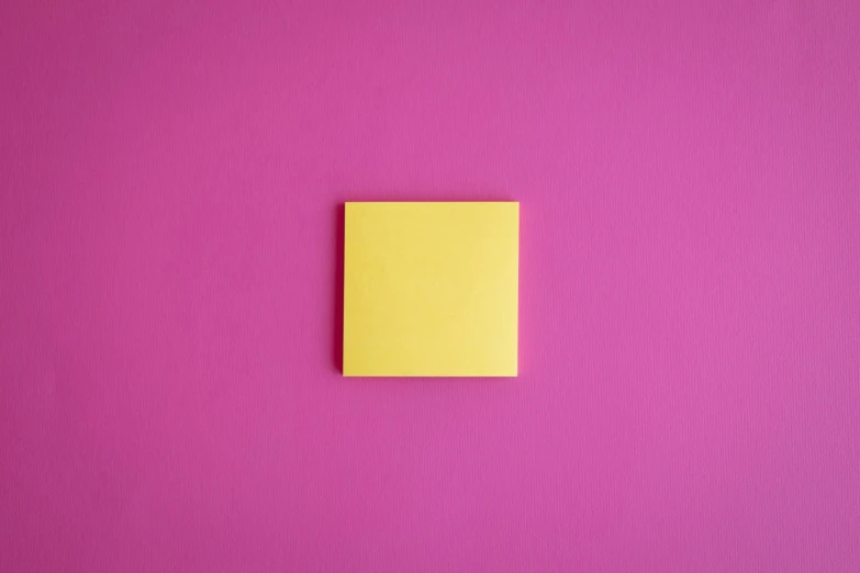 a yellow piece of paper sitting on top of a pink wall, trending on pexels, square, modular item, animation, notes