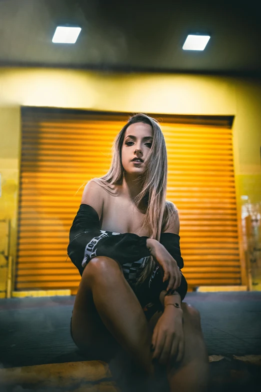 a woman sitting in front of a garage door, a portrait, inspired by Elsa Bleda, unsplash contest winner, jessica nigri, looking hot, pokimane, low lighting