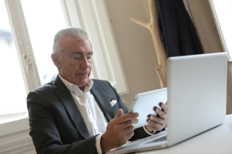 a man sitting in front of a laptop computer, a photo, by Carlo Martini, corporate boss, older male, 15081959 21121991 01012000 4k, fully dressed