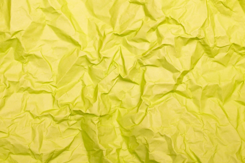 a close up of a sheet of yellow paper, inspired by Christo, pexels, conceptual art, pale green glow, 🍸🍋, porcelain organic tissue, marvelous designer substance