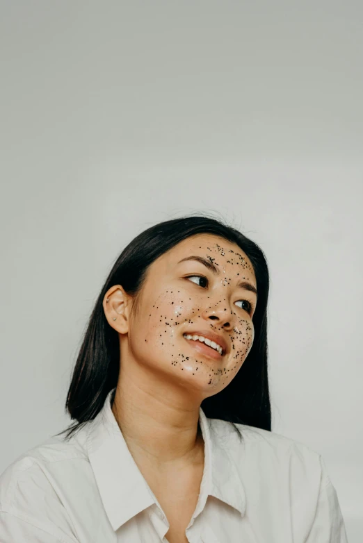 a woman with freckles on her face, an album cover, trending on pexels, mingei, asian hyperdetailed, face mask, covered with tar, she is happy