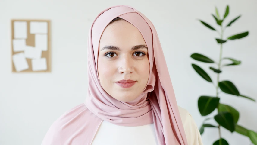 a close up of a person wearing a headscarf, light blush, medium height, mid-20s, front