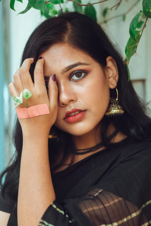 a close up of a woman with a ring on her finger, an album cover, by Max Dauthendey, trending on pexels, beautiful young himalayan woman, square, bracelets, handcrafted